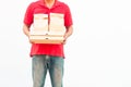 Holding various take-out food containers, pizza box, in holder and paper bag, close-up. Royalty Free Stock Photo