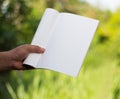 holding white journal Royalty Free Stock Photo