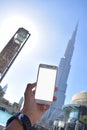 Holding white phone with Burj Khalifah Background