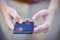 Holding the world in the palm of my hand. a businesswoman using a smartphone to send a text message. Royalty Free Stock Photo