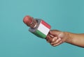 holds a microphone patterned with the italian flag Royalty Free Stock Photo