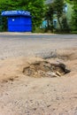 The hole in the asphalt on the road in the village.