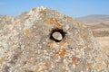 Hole in big stone. Karahunj. Armenia.