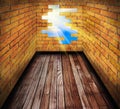 Hole in the brick wall of room with wooden floor Royalty Free Stock Photo