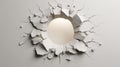 A hole is broken through a white wall revealing a soft light source behind the shattered plaster Royalty Free Stock Photo