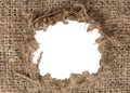 Hole in burlap. Torn piece of burlap fabric with a hole in the middle texture Royalty Free Stock Photo
