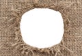 Hole in burlap. Torn piece of burlap fabric with a hole in the middle texture Royalty Free Stock Photo