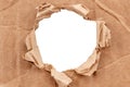 Hole in cardboard. A torn piece of cardboard or paper. Blank space for text Royalty Free Stock Photo