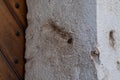 Hole carved into a stone door post where a Jewish mezuzah was once placed, Krakow, Poland