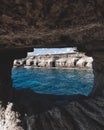 Hole in a cave with a beautiful view on sea near cape Greco in national park Royalty Free Stock Photo