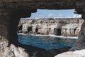 Hole in a cave with a beautiful view on sea near cape Greco in national park Royalty Free Stock Photo