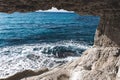 Hole in a cave with a beautiful view on sea near cape Greco in national park Royalty Free Stock Photo