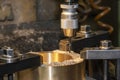 The hole center-drill process on brass material parts by center drill tool Royalty Free Stock Photo