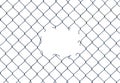 Hole In A Chain-Link Fence Royalty Free Stock Photo