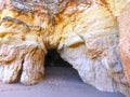 View of a cave through a opening in a Algarve cave in Portimao Portugal at praia da rocha Royalty Free Stock Photo