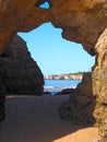 View of the sea through a opening in a Algarve cave in Portimao Portugal at praia da rocha Royalty Free Stock Photo