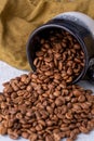 Hole coffee beans in a ceramic cup Royalty Free Stock Photo