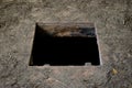 Hole in floor of old house leading to cellar