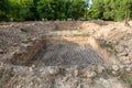 A hole in the ground. Dig the pit for planting saplings. mud hole for planting tree. View of hole in the dirt with preparation for Royalty Free Stock Photo