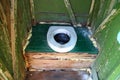 Hole of the old dirty country toilet, rural toilet inside