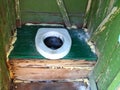 Hole of the old dirty country toilet, rural toilet inside