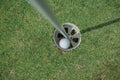 Hole in One. Golf ball in the hole Royalty Free Stock Photo