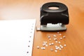 Hole puncher with paper and confetti Royalty Free Stock Photo