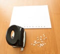 Hole puncher with paper and confetti Royalty Free Stock Photo