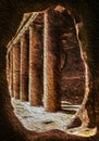 Hole in the rock framing a colonnade in Petra