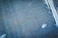 Hole and Threads on Denim Jeans.  Jeans torn denim texture. Royalty Free Stock Photo