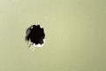 Hole wall green background Royalty Free Stock Photo