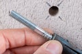 Hole in the wall, screw and dowel for fixing in concrete. Wall mounting methods Royalty Free Stock Photo