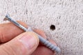 Hole in the wall, screw and dowel for fixing in concrete. Wall mounting methods Royalty Free Stock Photo
