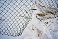 Hole in wire border fence.