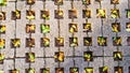 Holed tiled paving blocks pattern high angle view in the morning