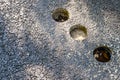 Holes in asphalt pavement, drilled cylindrical specimen for laboratory testing