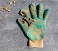 Holey working gloves at a construction site at home Royalty Free Stock Photo