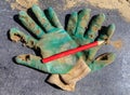 Holey working gloves at a construction site at home Royalty Free Stock Photo