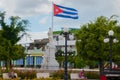 HOLGUIN, CUBA: Monument and flag of Cuba, which develops in the wind in the city center.