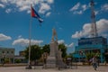 HOLGUIN, CUBA: Monument and flag of Cuba, which develops in the wind in the city center.