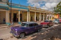 Holguin, Cuba: retro old cars parked on the street in the city center