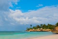 Holguin, Guardalavaca Beach, Cuba: Caribbean sea with beautiful blue-turquoise water and gentle sand and palm trees. Paradise land Royalty Free Stock Photo