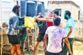 Holi celebration in india,young indian males playing holi