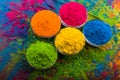 Holi color powder. Organic Gulal colours in bowl for Holi festival, Hindu tradition festive. Bright vibrant pigment closeup