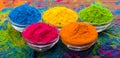 Holi color powder. Organic Gulal colours in bowl for Holi festival, Hindu tradition festive. Bright vibrant pigment closeup