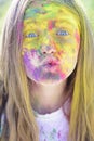 Holi. colorful neon paint makeup. Happy youth party. Optimist. Spring vibes. Crazy hipster girl. Summer weather