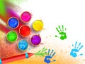 Holi festival background with top view of color bowls and guns. Royalty Free Stock Photo