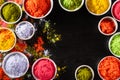 Holi festival celebration. Traditional Indian Holi colours powder decoration with paints. Top view of Organic Gulal colors in Royalty Free Stock Photo