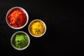 Holi festival celebration. Traditional Indian Holi colours powder decoration with paints. Top view of Organic Gulal colors in Royalty Free Stock Photo