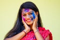 Holi Festival Of Colours. Portrait of happy indian girl in traditional hindu sari on holi color . india woman silver Royalty Free Stock Photo